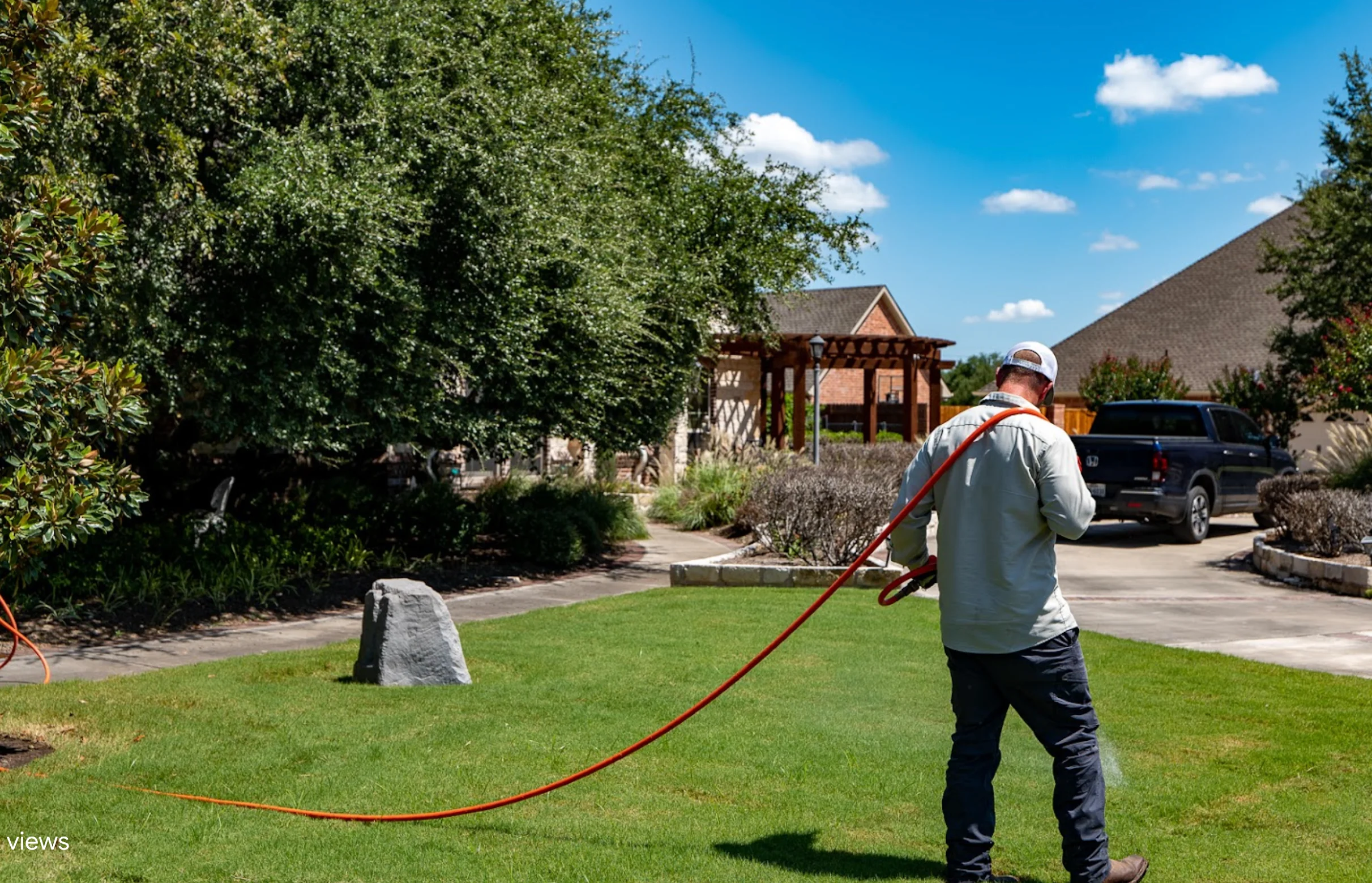 Technician working on grass treatment