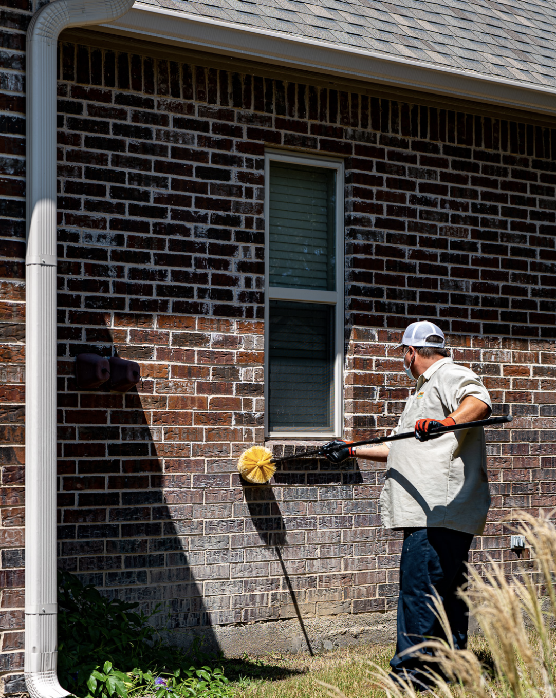 Tech cleaning outside window